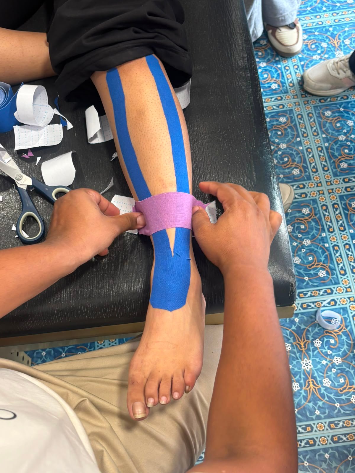 Adult physiotherapy taping session